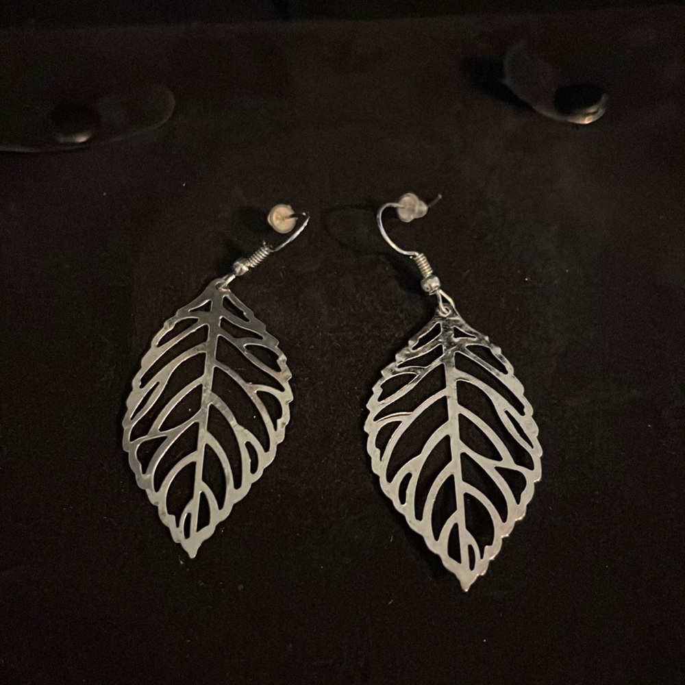 Silver toned feather fashion earrings